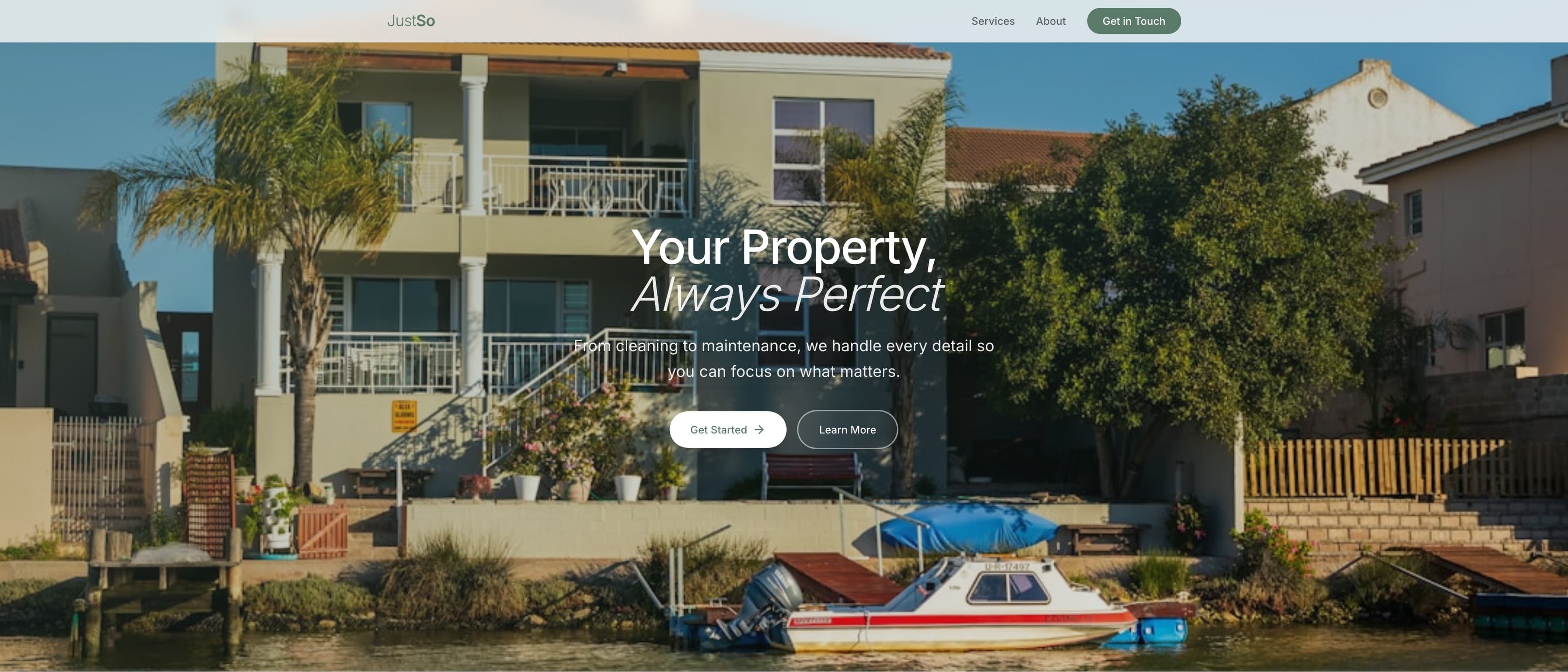 The JustSo home page — “Your Property, Always Perfect” over a photograph of a waterfront house with a boat moored below it, above “Get started” and “Learn more”.